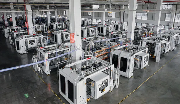 showing a long horizontal cup machine line